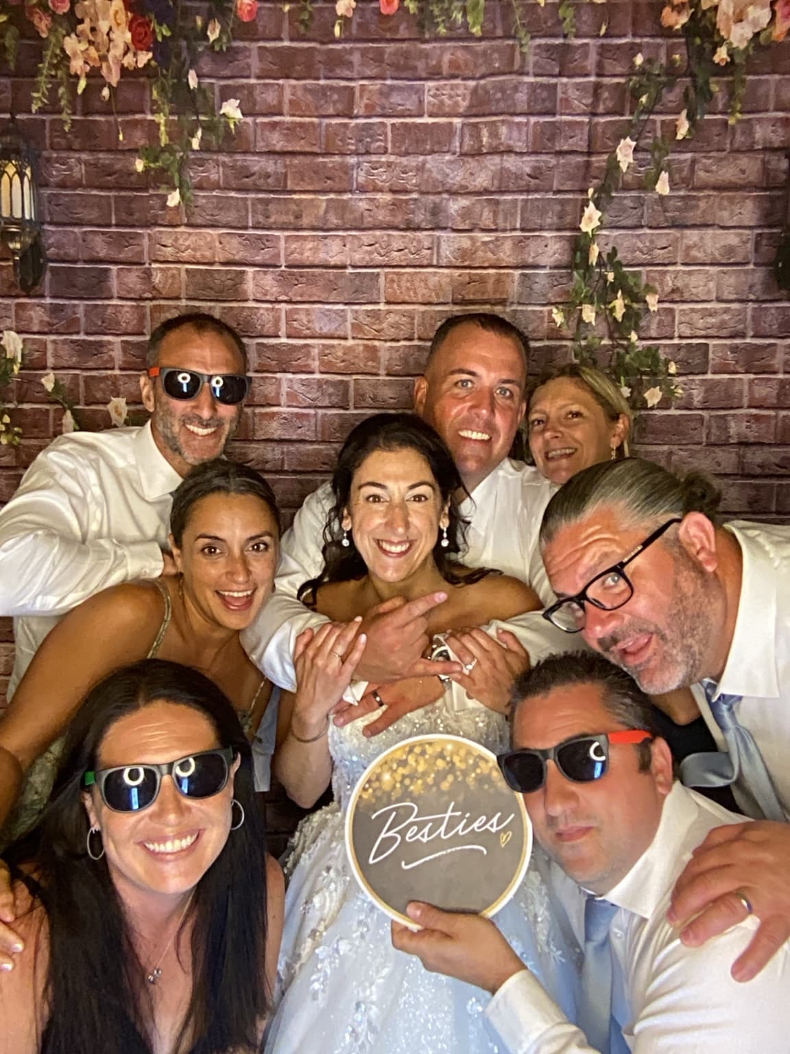 Wedding guests having fun together in a photo booth
