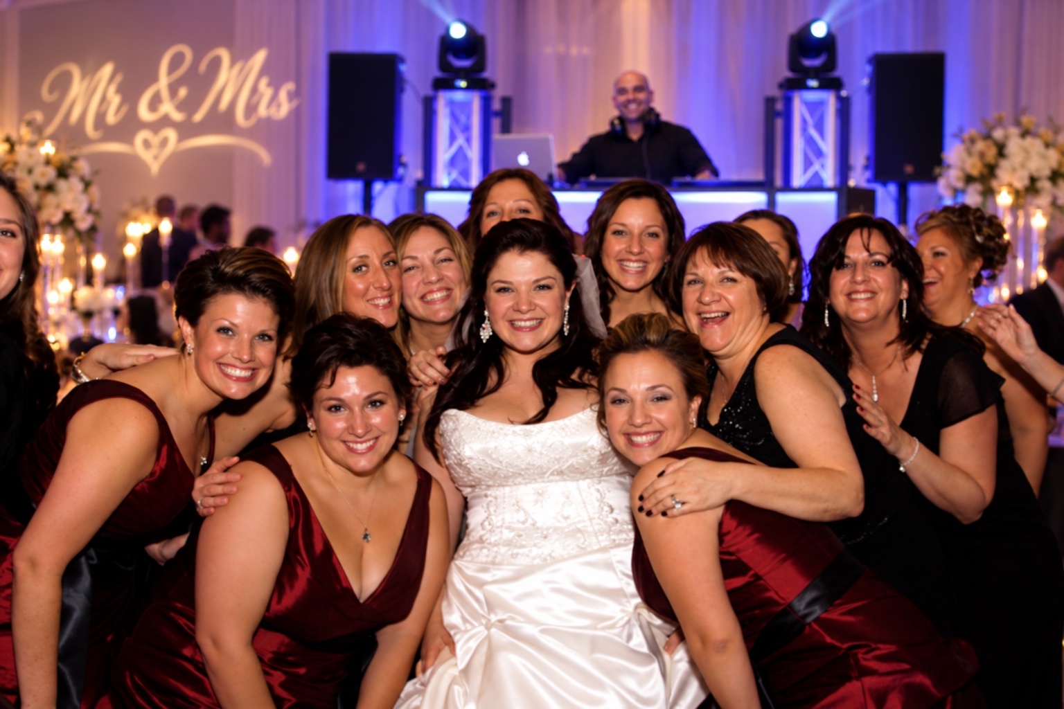 Bride and bridesmaids celebrating at a wedding reception